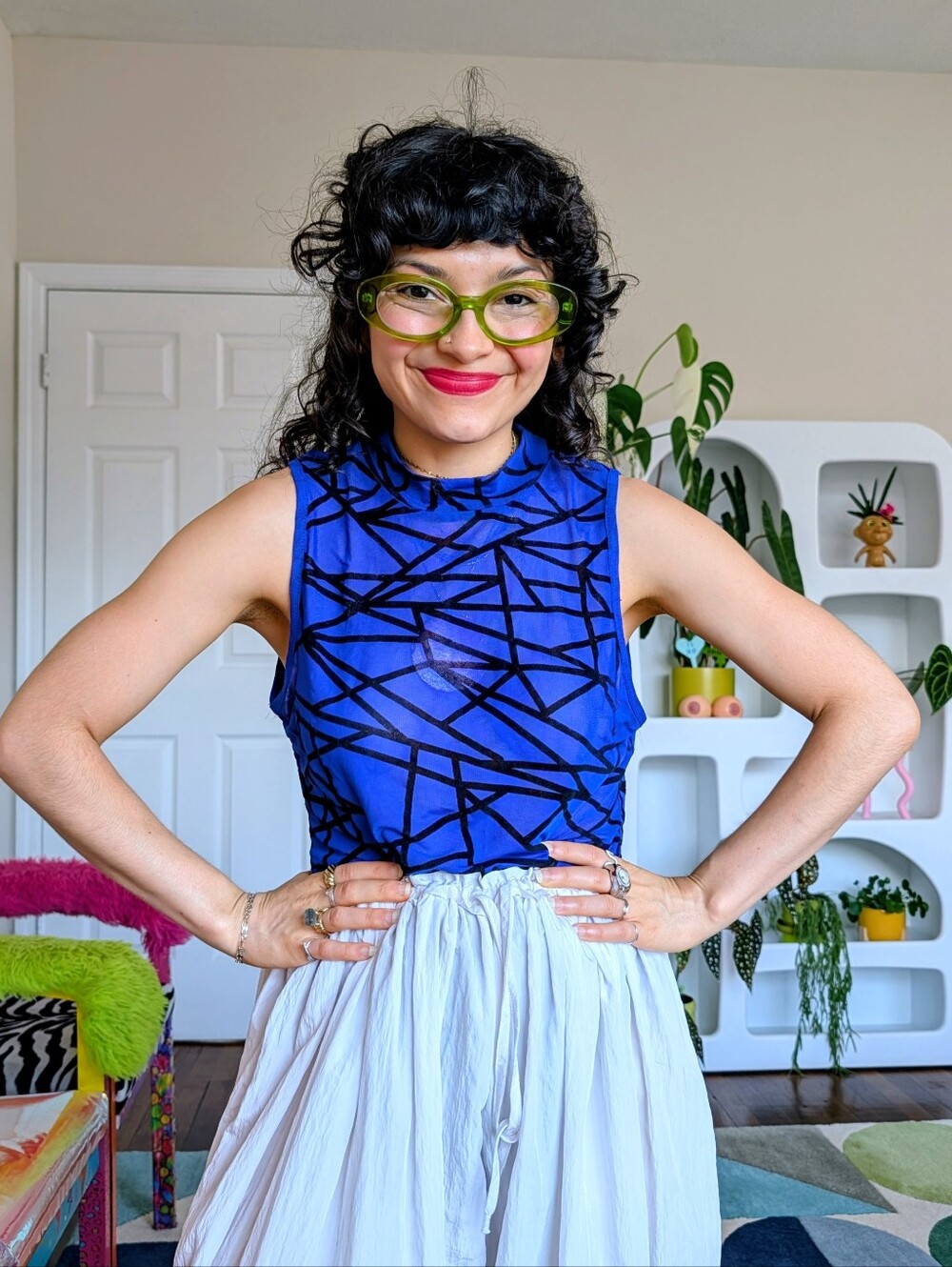 Bright cobalt blue mesh bodysuit with black geometric lines